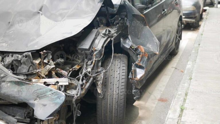black-car-damaged-by-a-road-accident-photo-focus-0-0-896-504