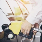 man-putting-gasoline-fuel-into-his-car-pump-gas-station-728x486